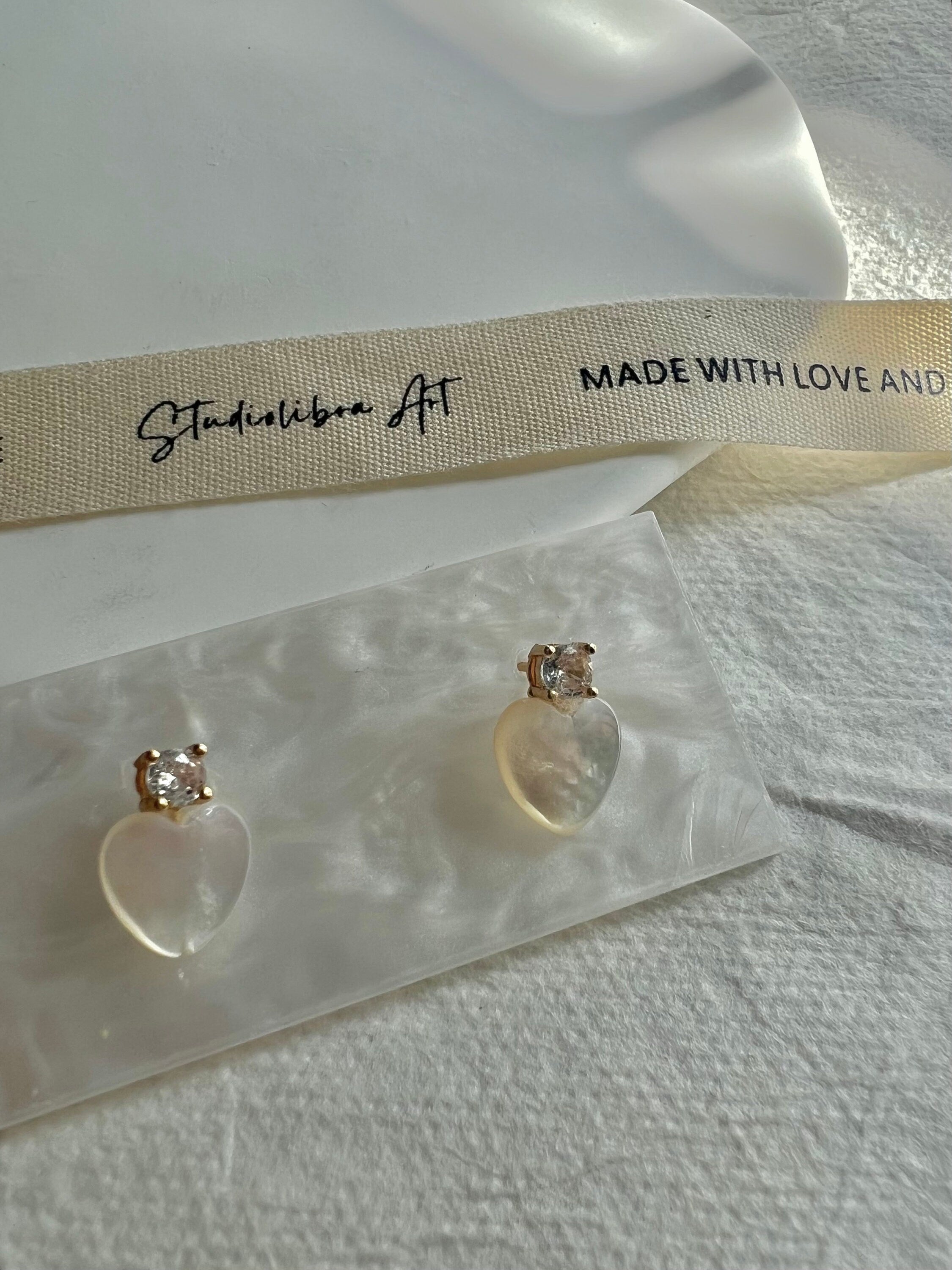 Dainty mother of pearl Minimalist heart earrings. Statement pearl earrings. Adorable earrings. Bridesmaid gift.