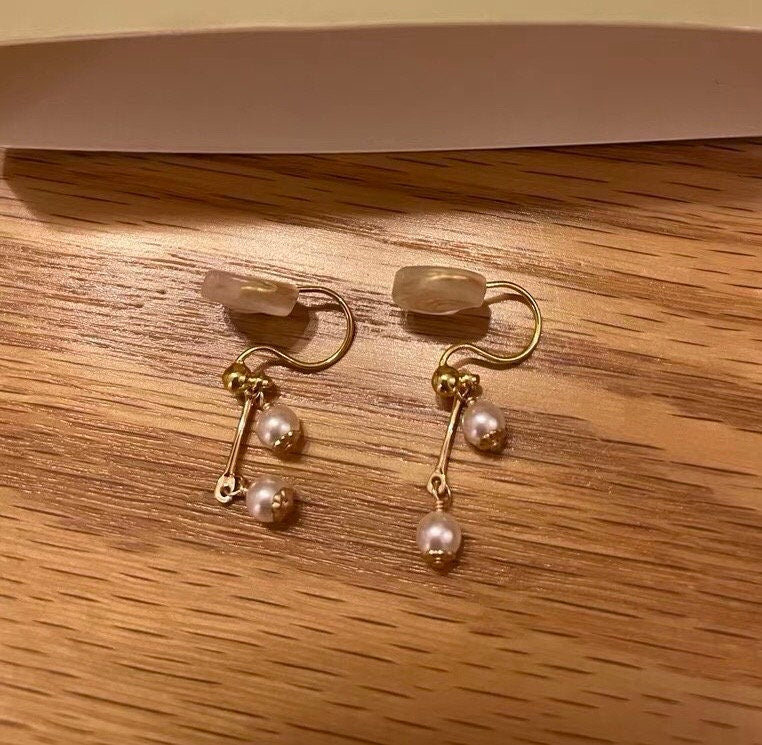 14K gold filled freshwater tiny pearl earring. Dainty earrings. Minimalist clip on earrings. Bridal earrings. No pain earrings.
