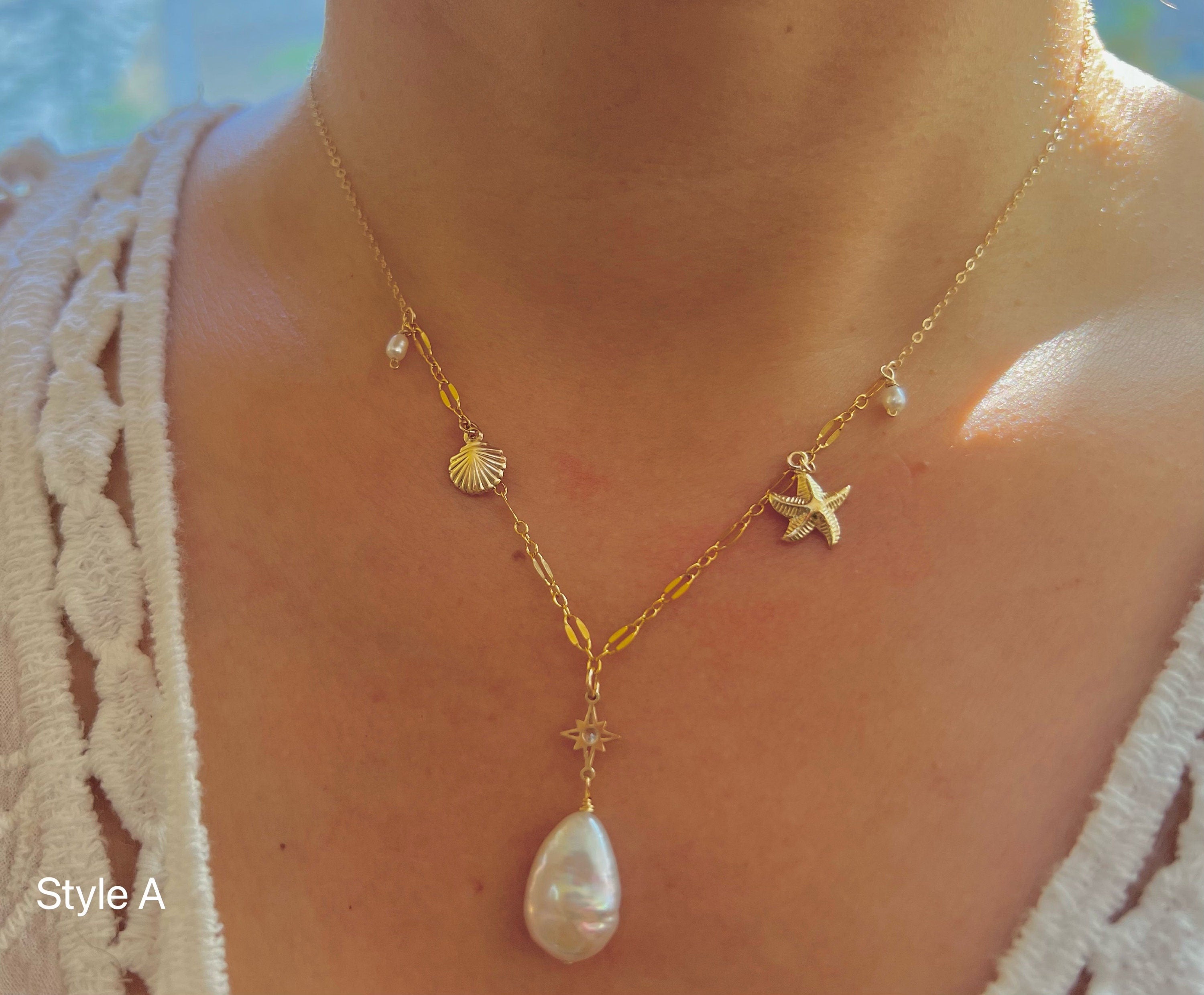 14K gold filled freshwater charm necklace. Multiple-chain necklace. Freshwater pearl necklace. Shell starfish leafs necklace.