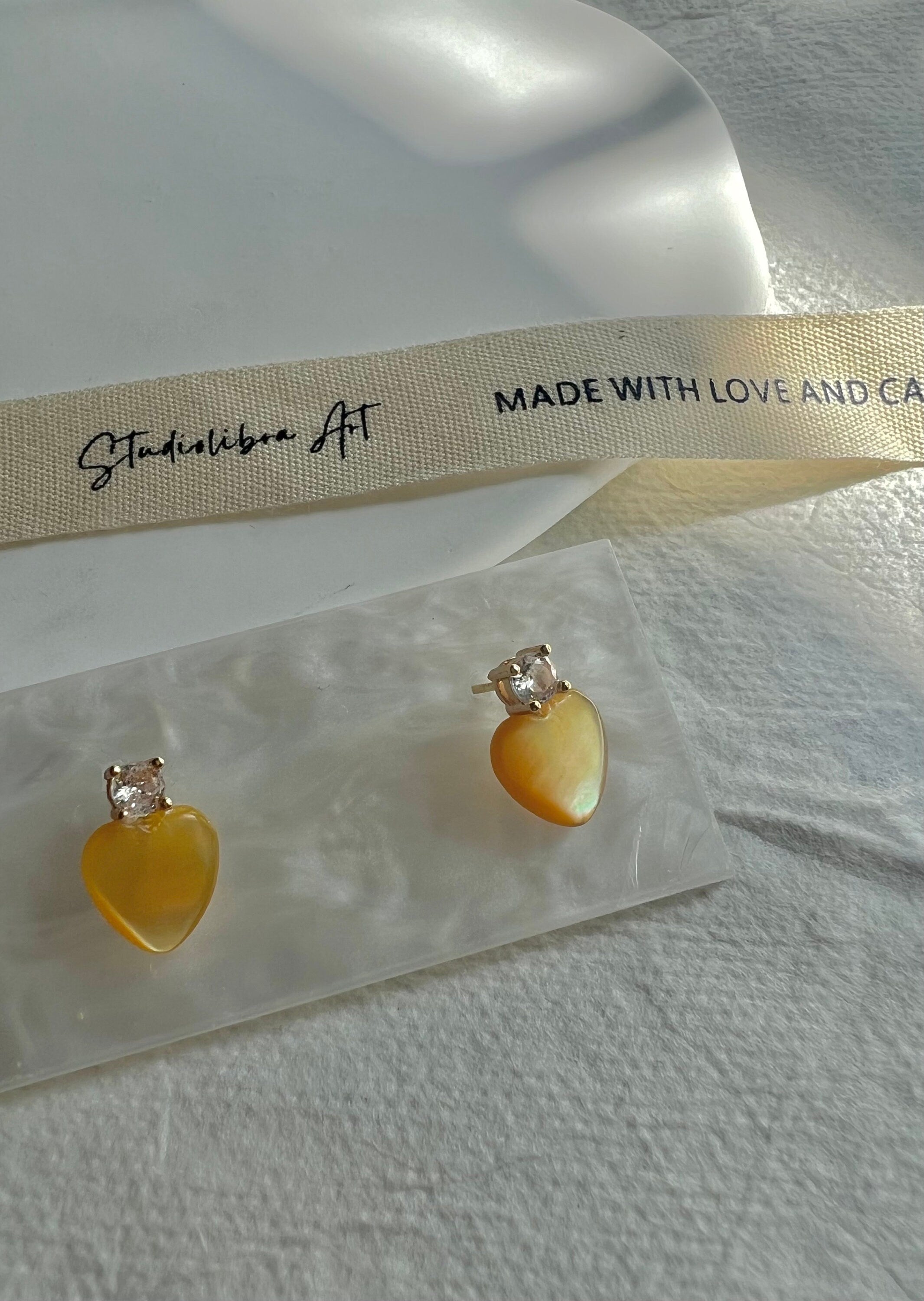 Dainty mother of pearl Minimalist heart earrings. Statement pearl earrings. Adorable earrings. Bridesmaid gift.