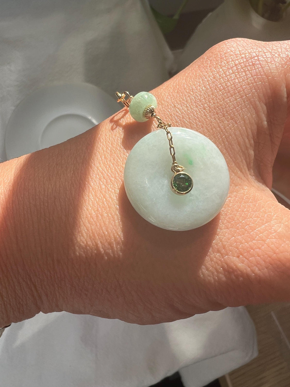 Jadeite Donut Pendant with Green Gemstone