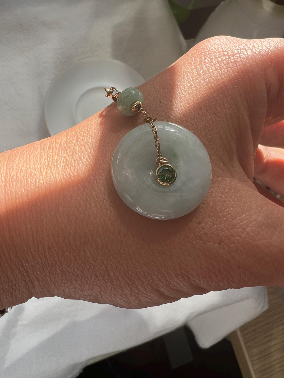 Jadeite Donut Pendant with Green Gemstone