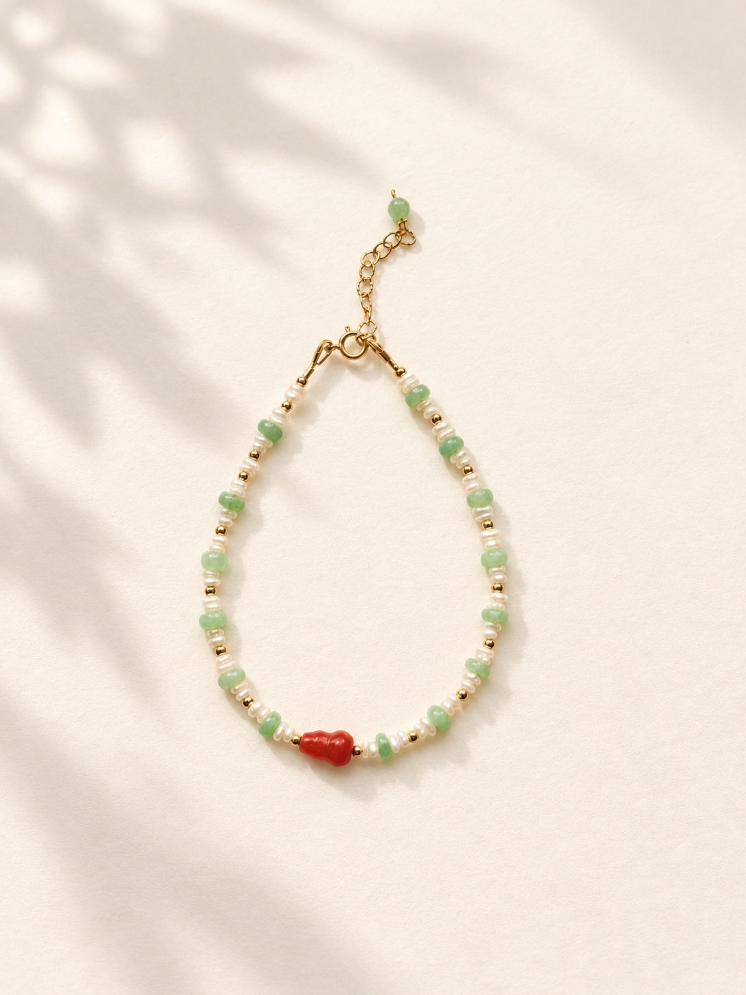 Full view of jadeite and freshwater pearl gourd bracelet with extender