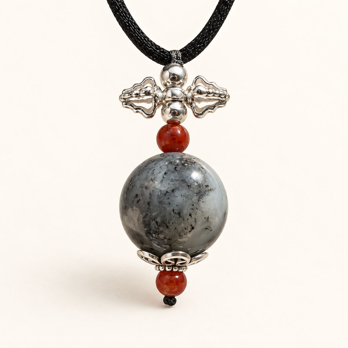 Black and gray nephrite vajra pendant with Nanhong agate and sterling silver, hero view