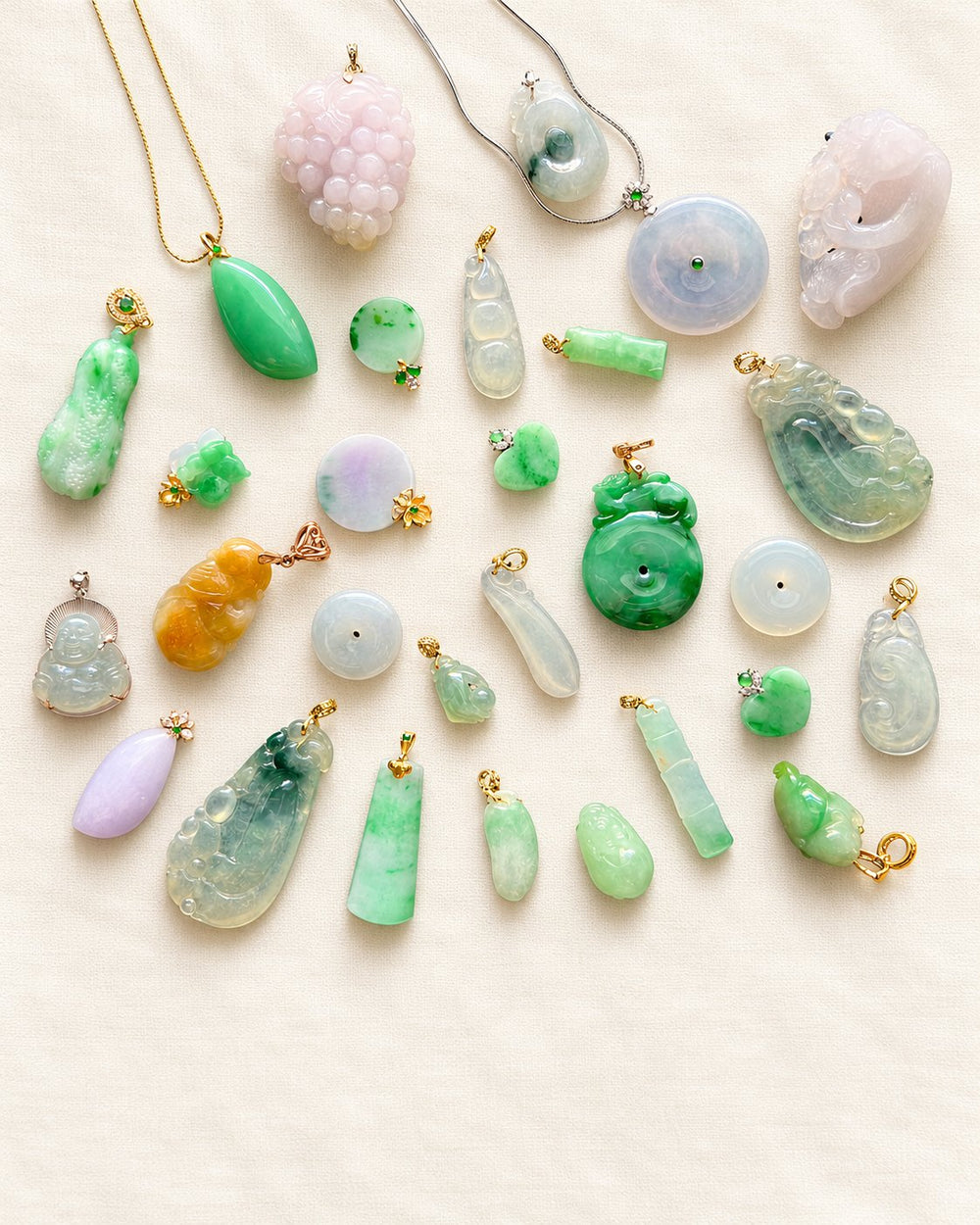 Lansattic jadeite jewelry collection on warm ivory fabric