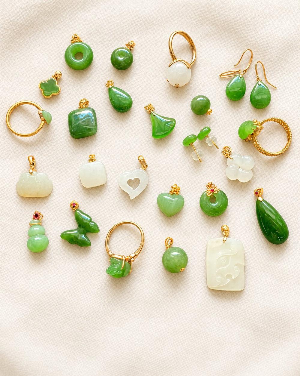 Lansattic nephrite jade collection on warm ivory fabric