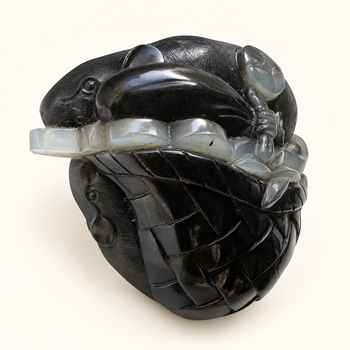 Retouched alternate view of the black and white nephrite mice and coin pouch carving on a warm ivory background