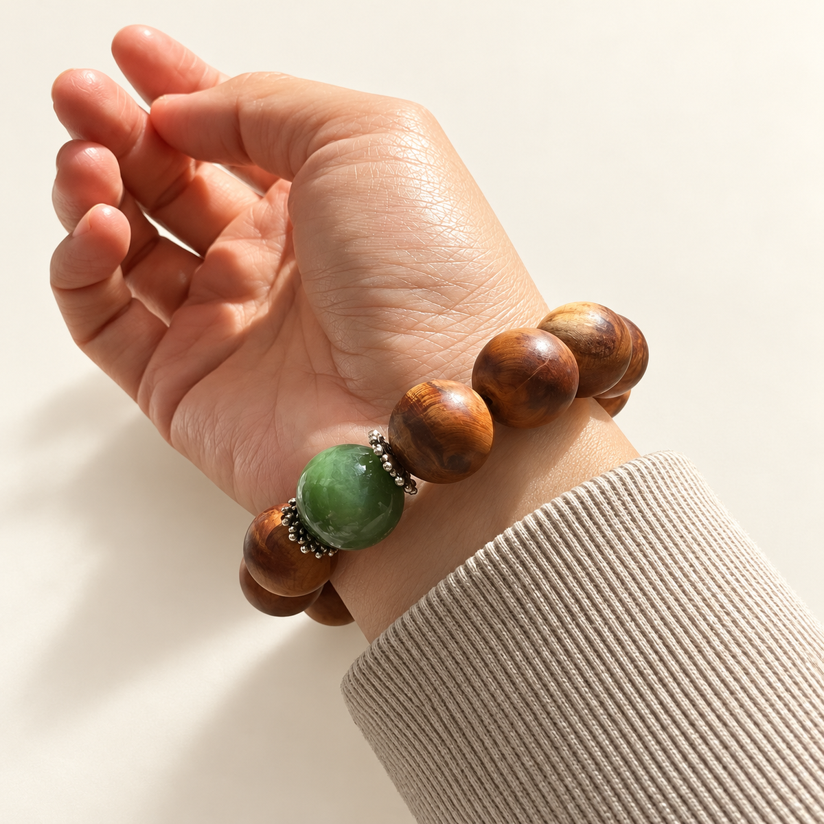 Yabai wood and nephrite dragon bracelet worn on the wrist.
