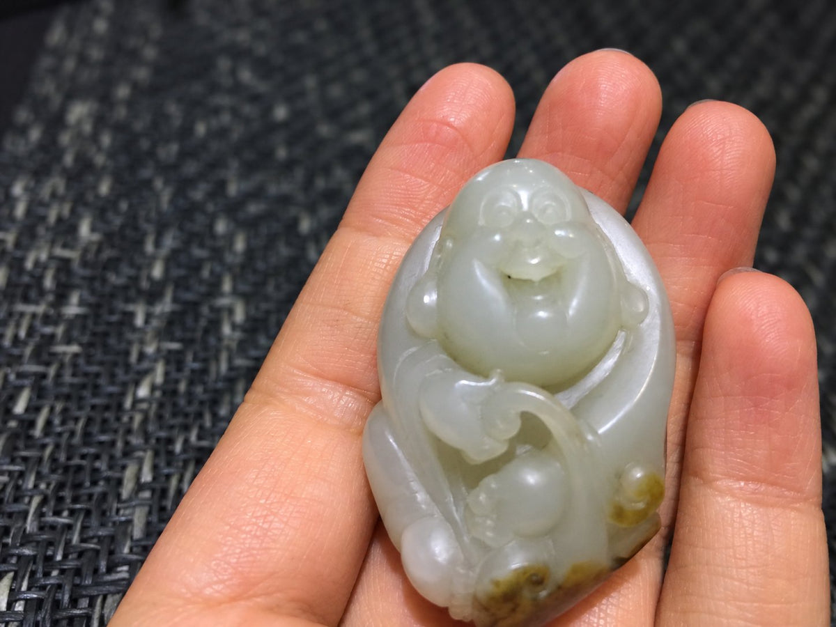 The founder's nephrite laughing Buddha, held in her hand