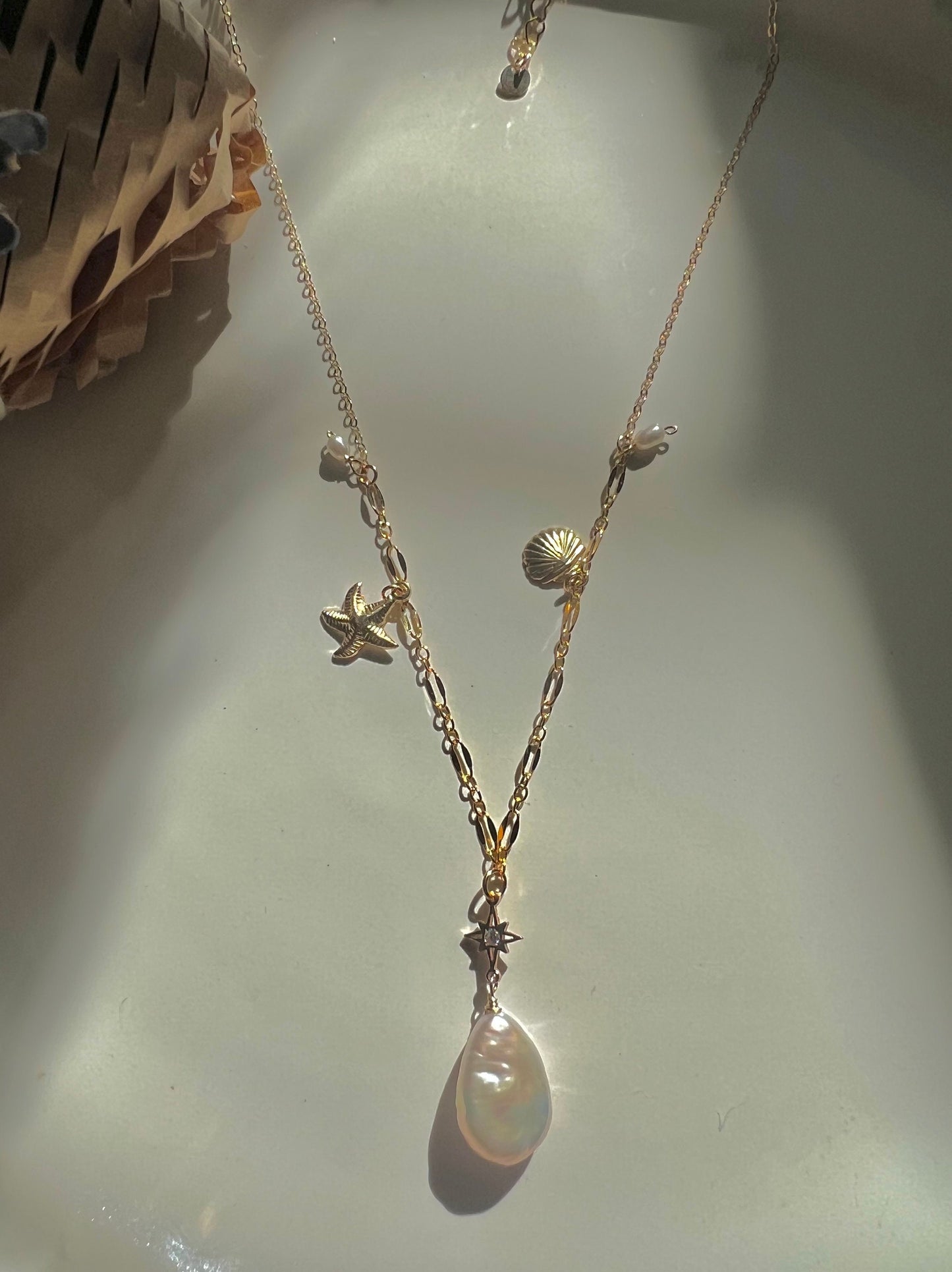 14K gold filled freshwater charm necklace. Multiple-chain necklace. Freshwater pearl necklace. Shell starfish leafs necklace.