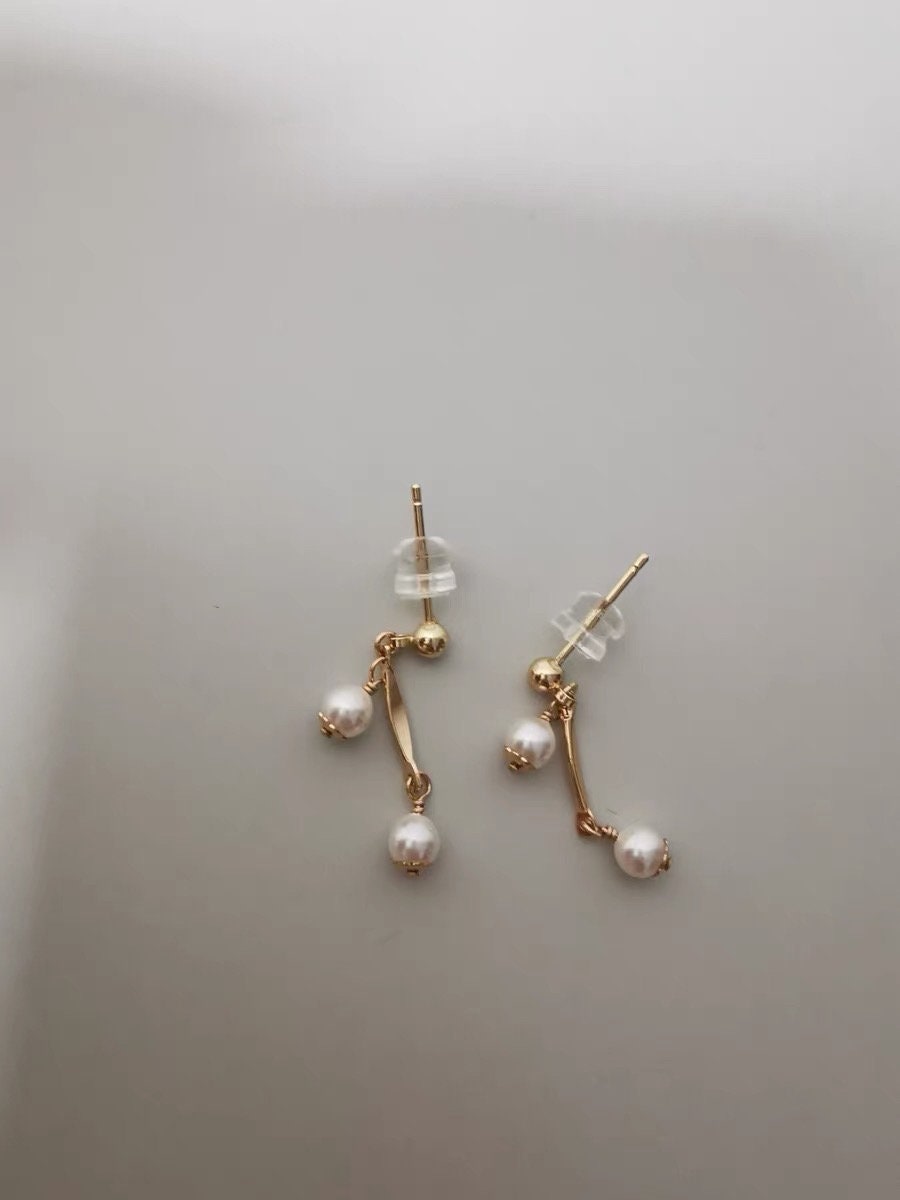 14K gold filled freshwater tiny pearl earring. Dainty earrings. Minimalist clip on earrings. Bridal earrings. No pain earrings.