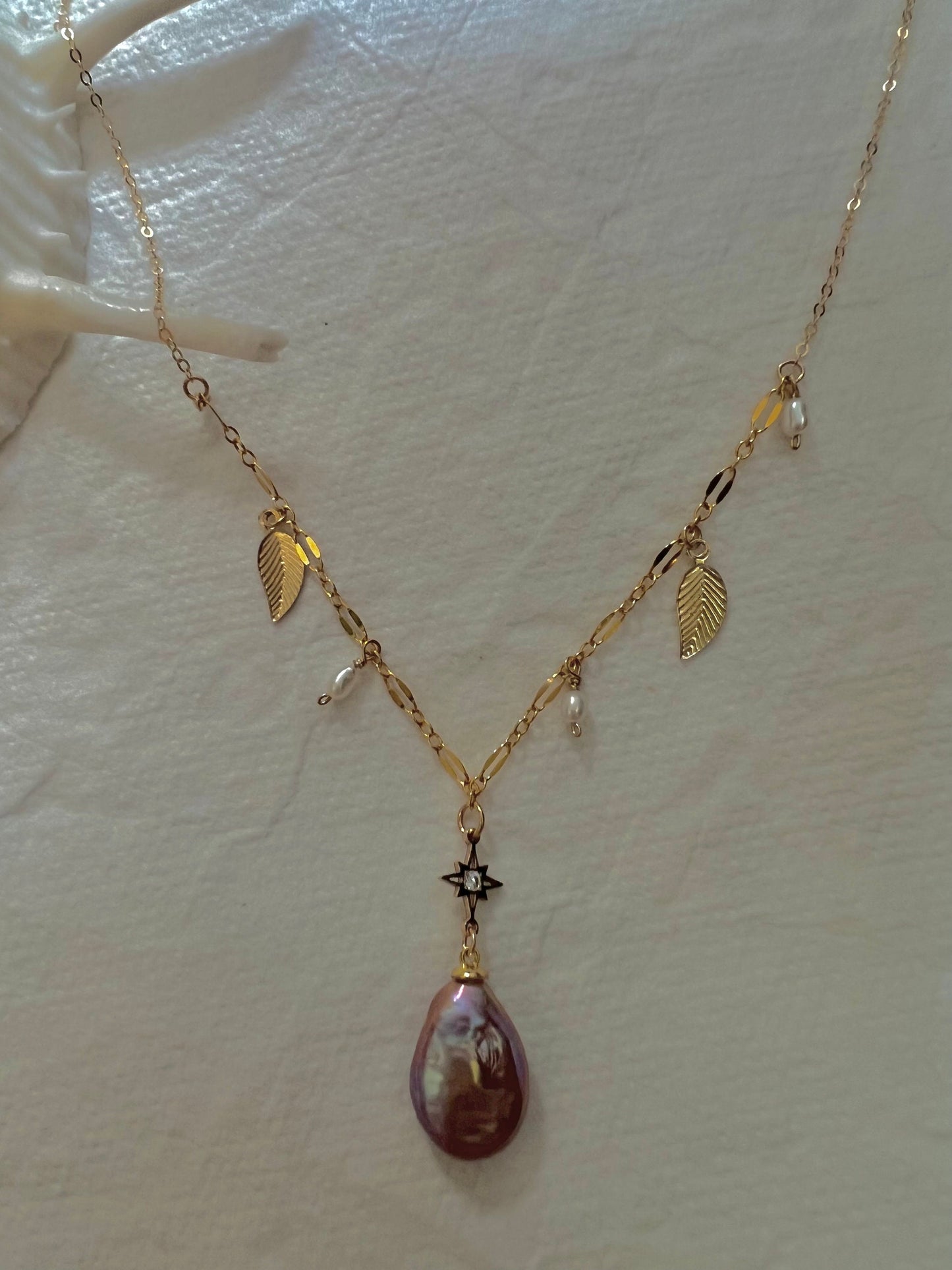 14K gold filled freshwater charm necklace. Multiple-chain necklace. Freshwater pearl necklace. Shell starfish leafs necklace.