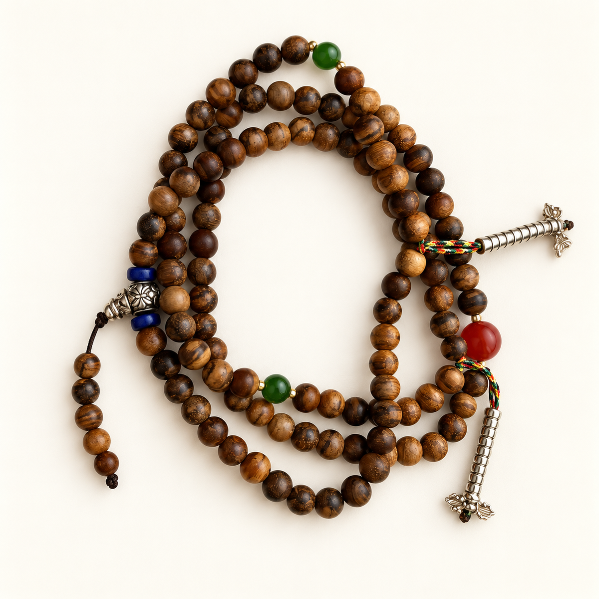 108 Huanghuali wood prayer beads with green nephrite jade and old agate accents.