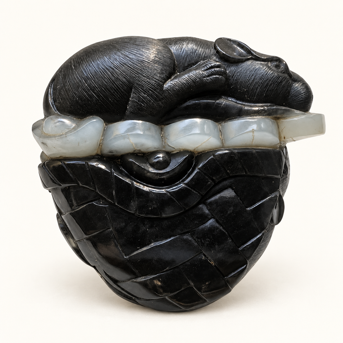 Retouched front view of the black and white nephrite mice and coin pouch carving on a warm ivory background