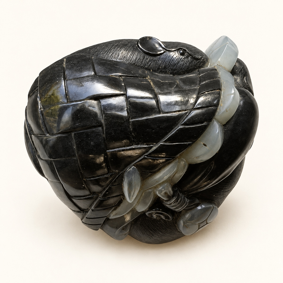 Retouched reverse angle of the black and white nephrite mice and coin pouch carving on a warm ivory background