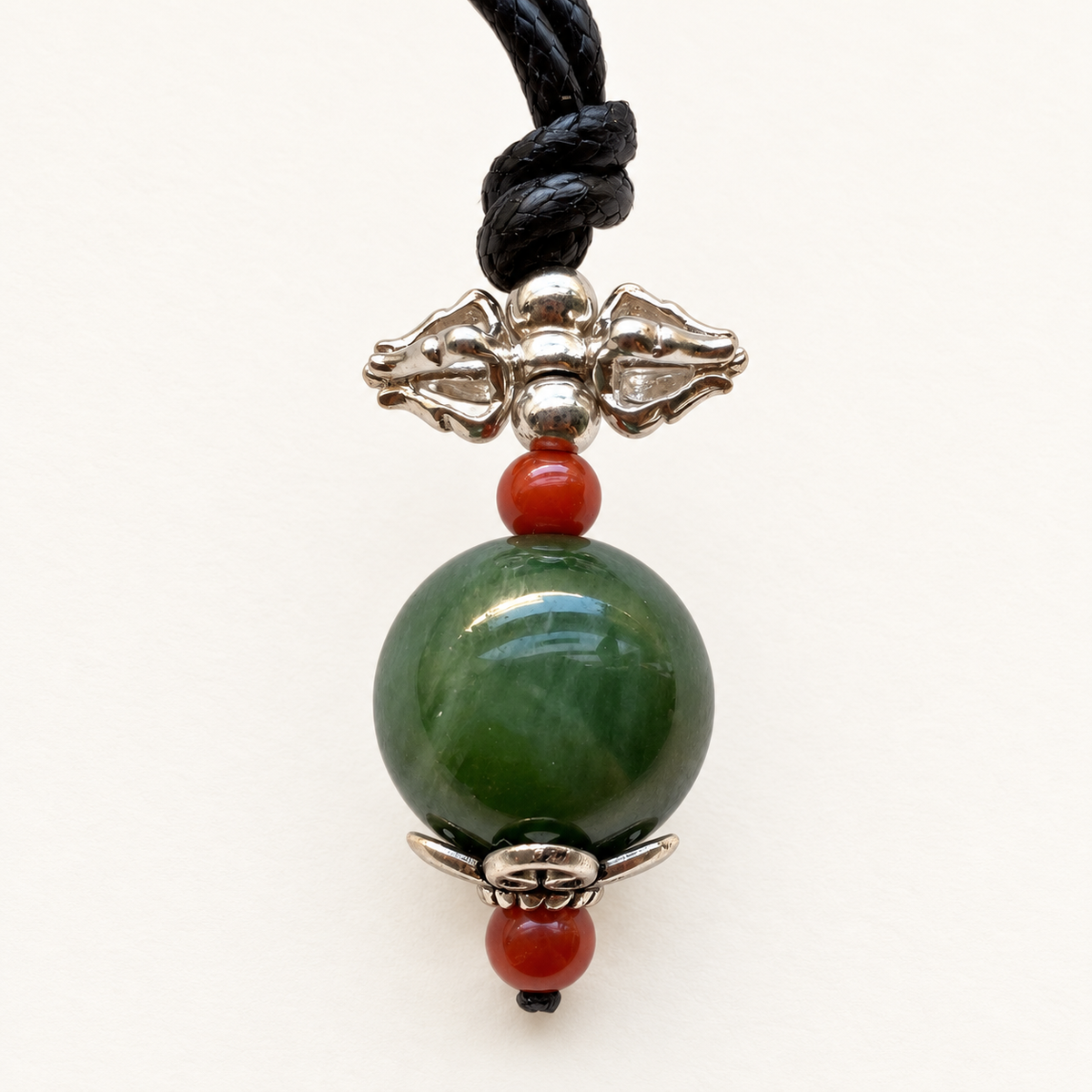 Green nephrite jade pendant with Nanhong agate and 925 sterling silver vajra.