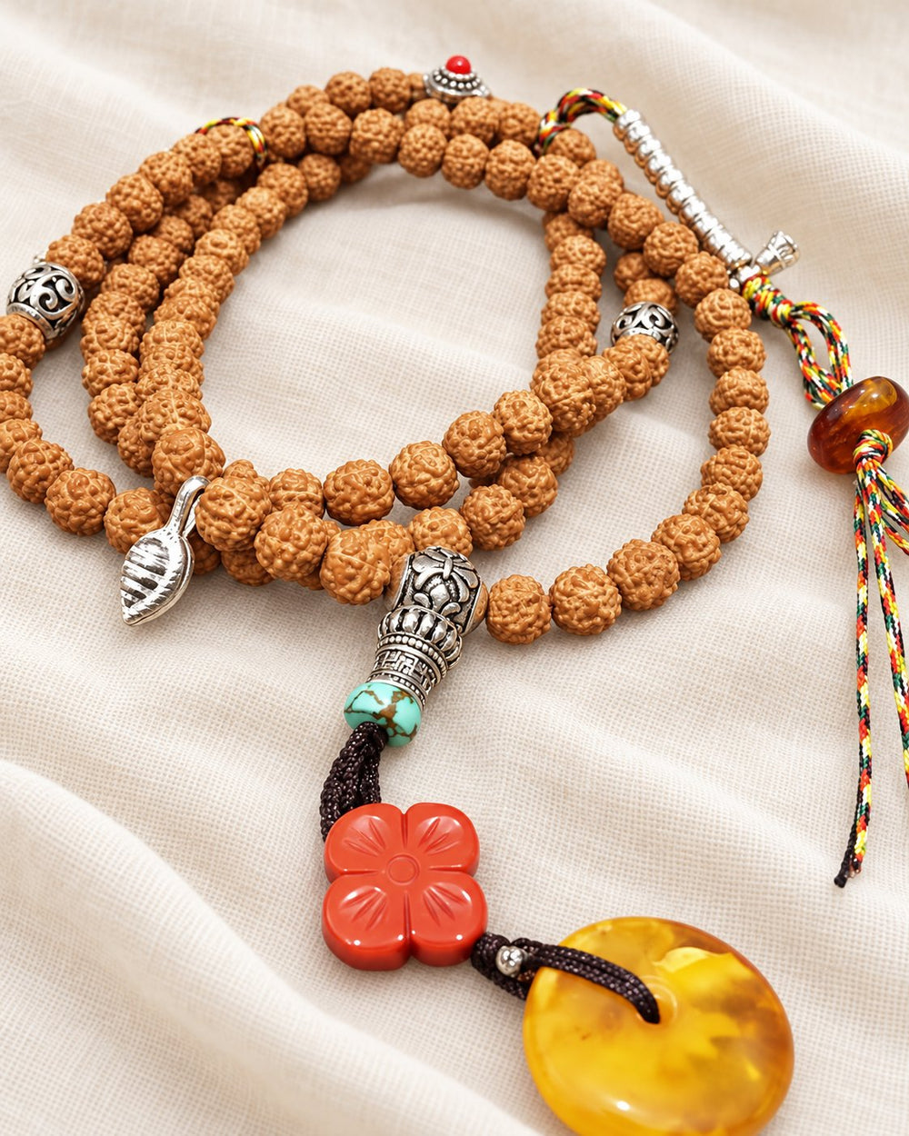 Textured Brown Prayer Beads on warm ivory fabric