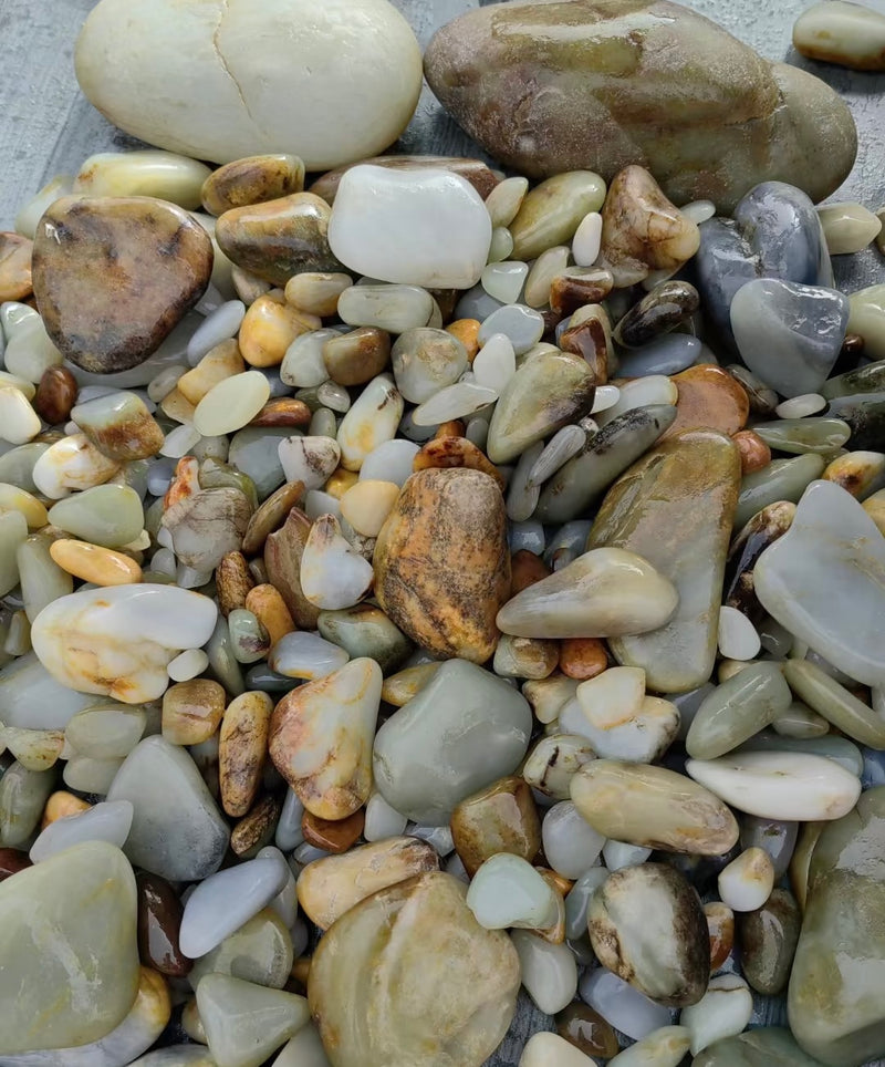 Natural jade stones in varied colors and textures from the founder’s archive.