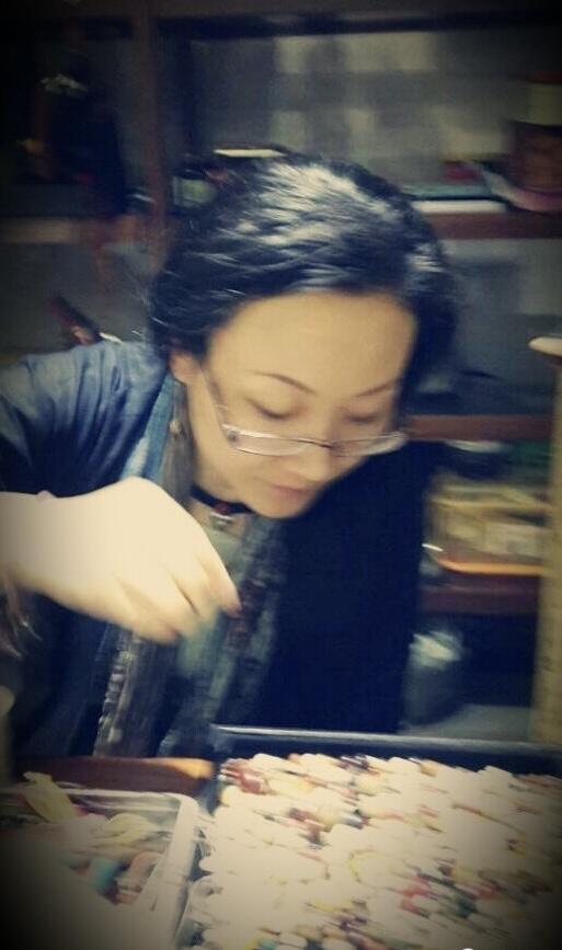 The founder selecting jewelry, from the Lansattic archive.