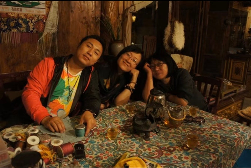 Friends gathered around a table in Shangri-La.
