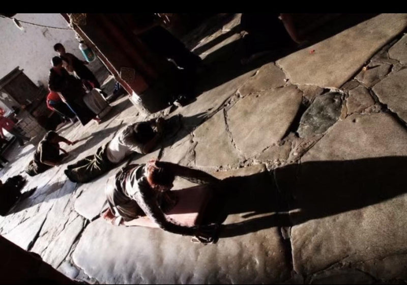 A personal travel photograph of contemplative practice in Tibet.